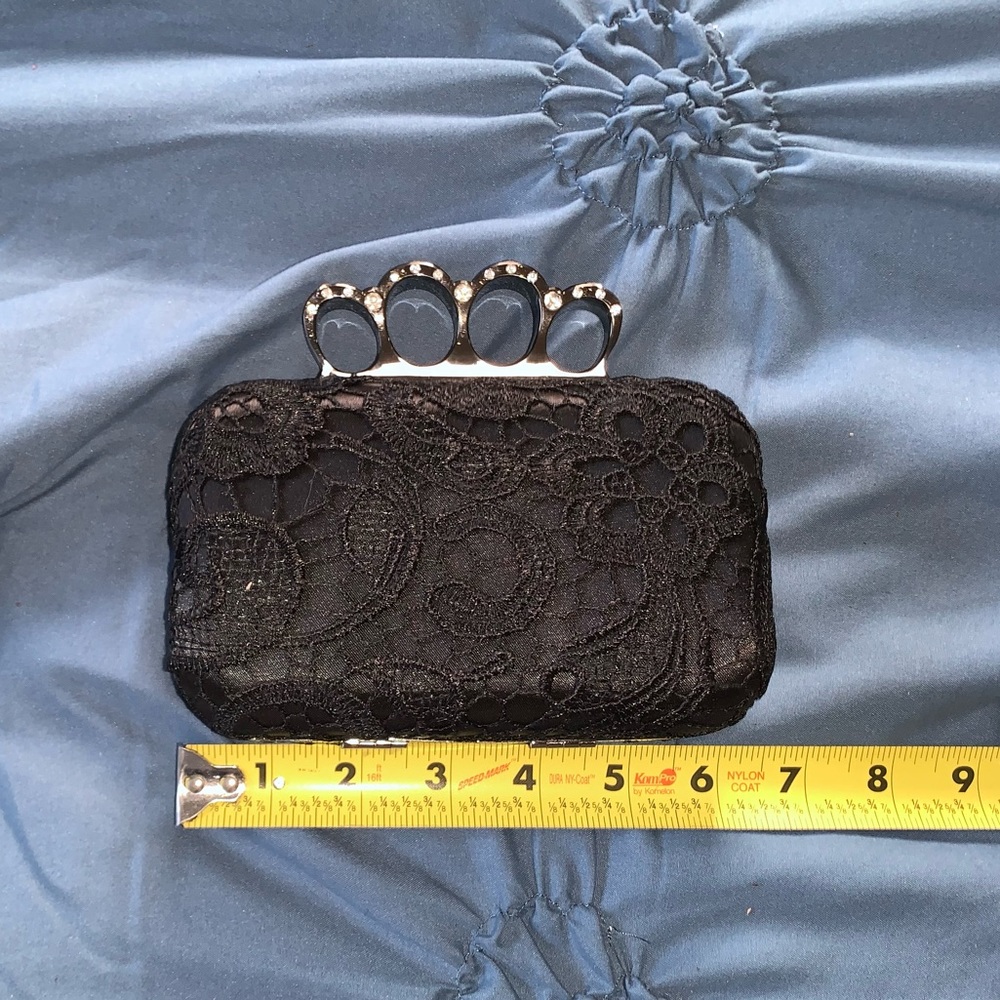 Black lace hard-sided clutch with rhinestone metal handle